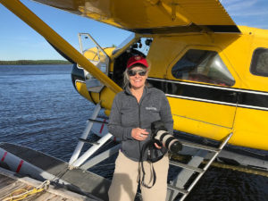 Karen is ready for the photo assignment flight in the Beaver